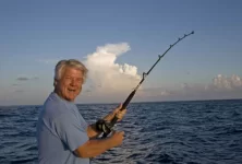 Coach_Johnson_displays_the_joys_of_fishing.webp
