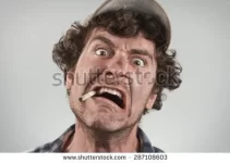 stock-photo-angry-redneck-yells-and-shouts-while-smoking-a-cigarette-287108603.webp