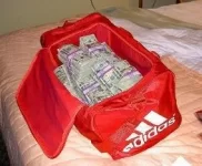 duffel-bag-of-money.webp