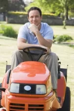 man-outdoors-on-lawnmower-smiling_SYJxRJ5Cri_thumb.webp