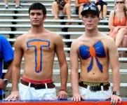 florida-gators-fans-tim-tebow-body-paint.webp